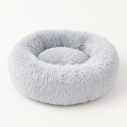 Ljusgrå WiggleBed hundbädd med rund form och stödjande kanter